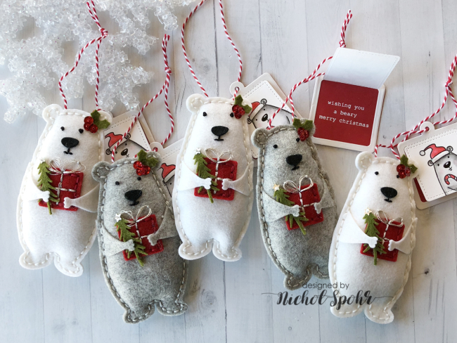 ornaments of white and grey polar bears holding red presents